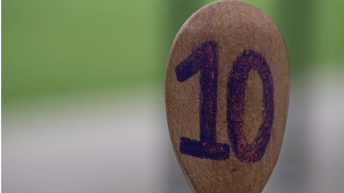 A wooden spoon with the number 10 written on it, symbolizing the 10-10-10 decision-making rule