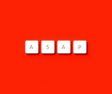 White keyboard keys spelling “ASAP” on a red background, symbolizing urgency and the essence of Parkinson’s Law: work expands to fill the time available.